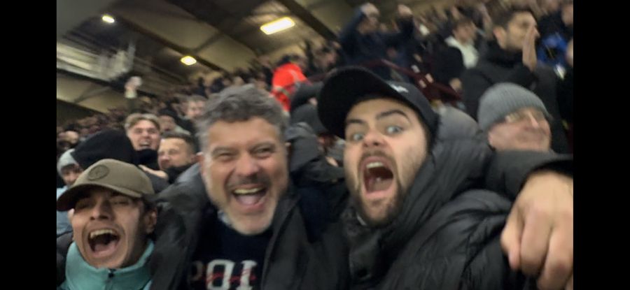 Alex and fellow Chelsea fans celebrating in the stands