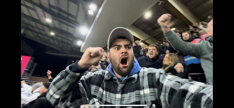 Alex celebrating in the away end on a Chelsea away day
