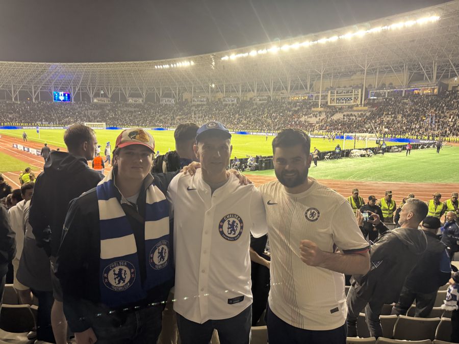 Alex at a Chelsea away game with family and friends